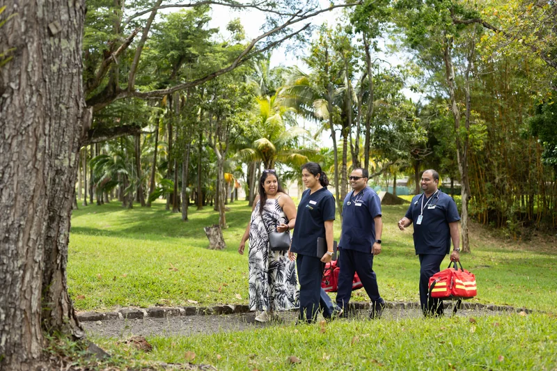 Members of the OCS Médecins care team walking outdoors in Mauritius